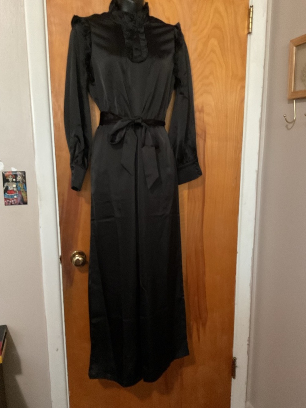 Disturbia Black Ruffled High-Neck Long-Sleeve Jumpsuit with waist tie.